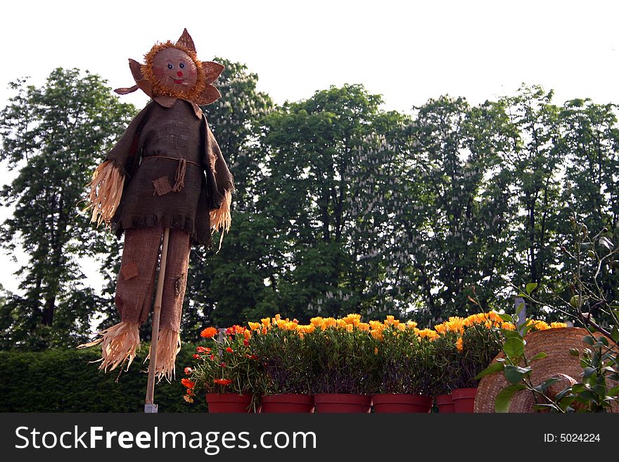 Smiling Scarecrow straw in an Italian garden