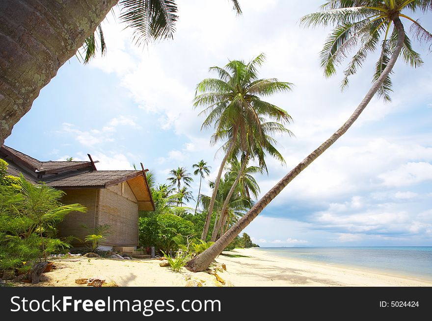 View of nice exotic hut on tropical beach. View of nice exotic hut on tropical beach