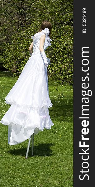 White woman on stilt