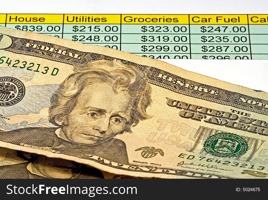 Close-up of two american twenty dollar bills with chart for budgeting. Close-up of two american twenty dollar bills with chart for budgeting