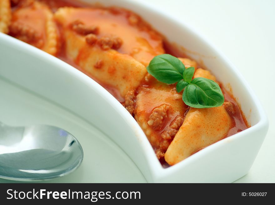 Some italian raviolis with a sauce of tomatoes