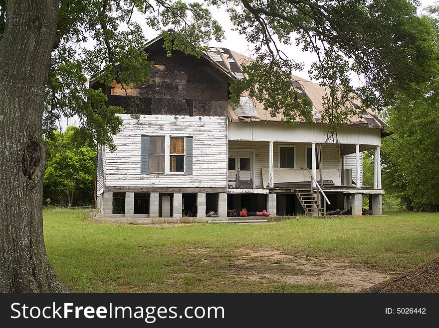 An old abandoned house that has suffered years of neglect. An old abandoned house that has suffered years of neglect.