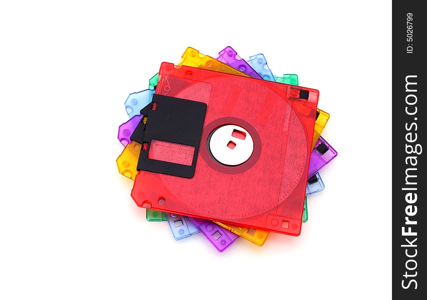 Pile of colorful floppy disks over a white surface