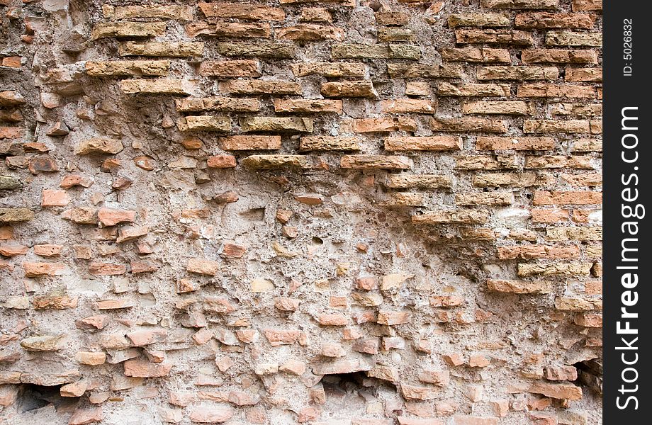 Ancient brick wall, partially crumbling