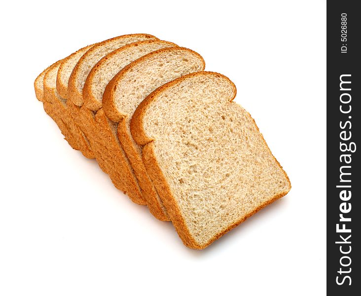 Several slices of whole grain bread over a white surface. Several slices of whole grain bread over a white surface