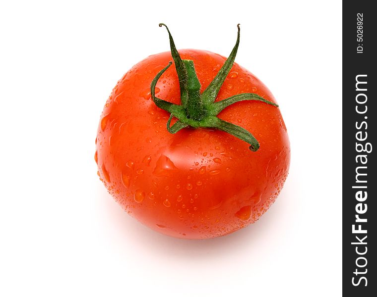 Fresh and juicy tomato with water drops on it