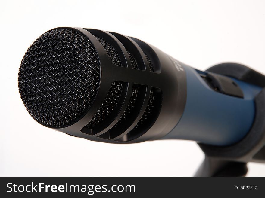 Black microphone grid close-up  over white