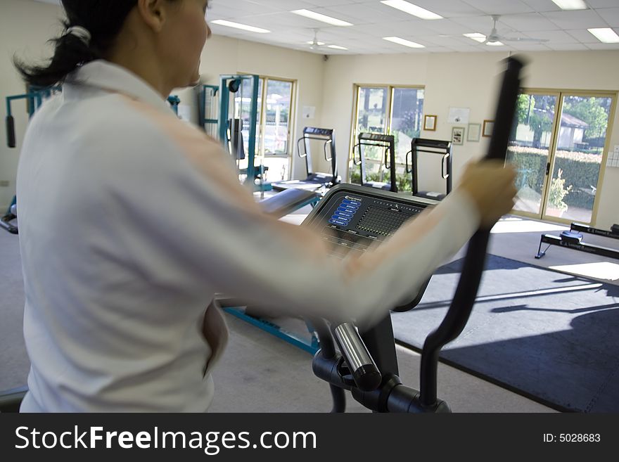 Young Girl Running On Treadmill