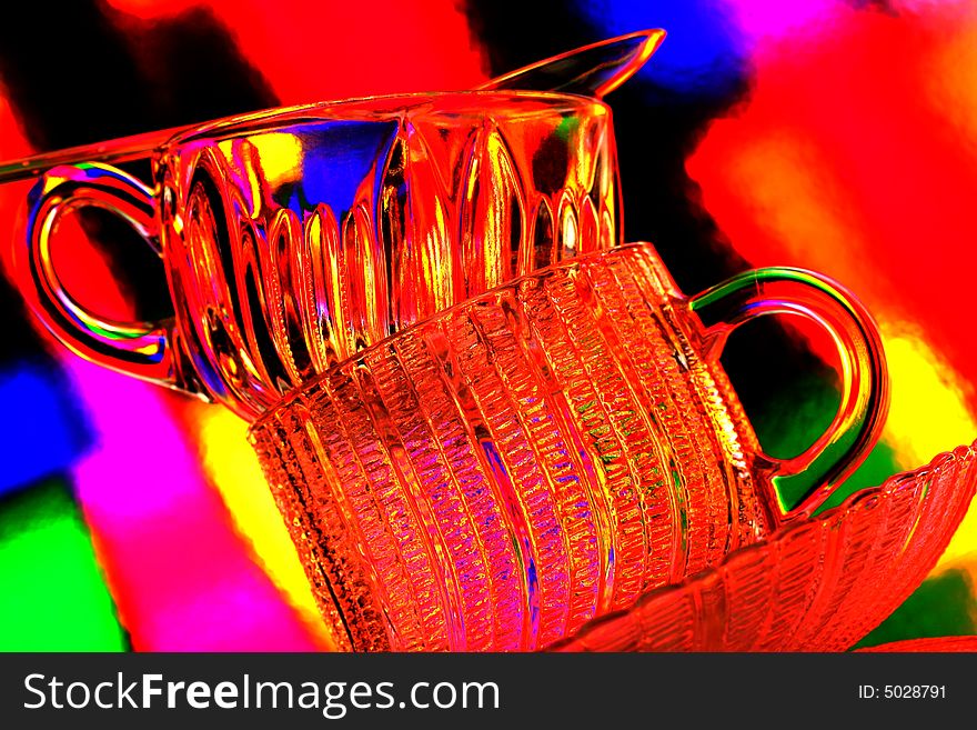 Glass of tea against multi colored abstract background. Glass of tea against multi colored abstract background.
