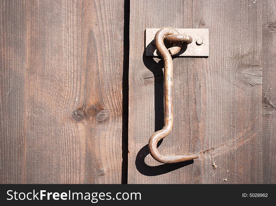Old door lock on wooden door