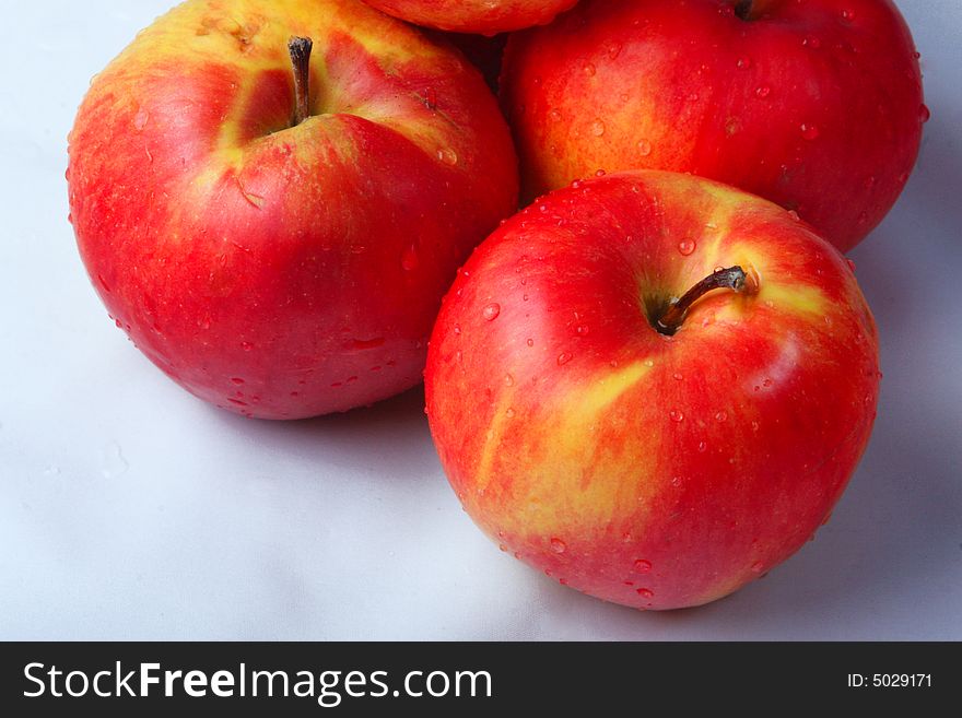 An orange and dome apples