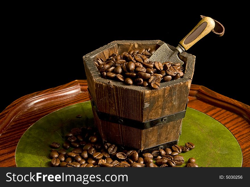 Wooden barrel of coffee at the table