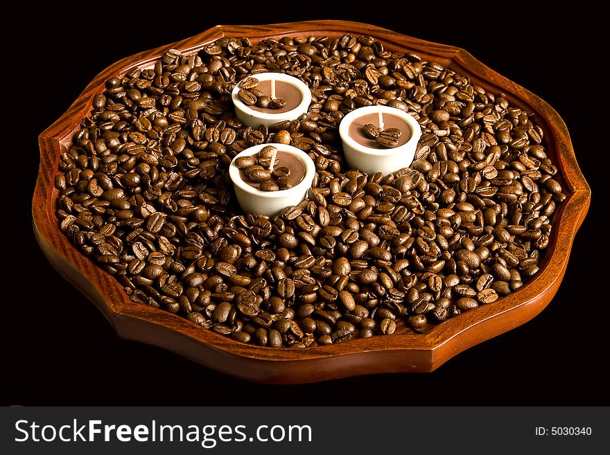 Three coffee candles in coffee beans