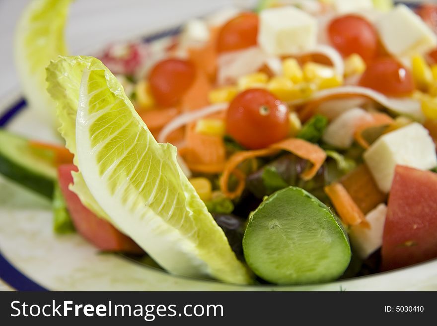 Macro shot of fresh vegetarian salad. Macro shot of fresh vegetarian salad.