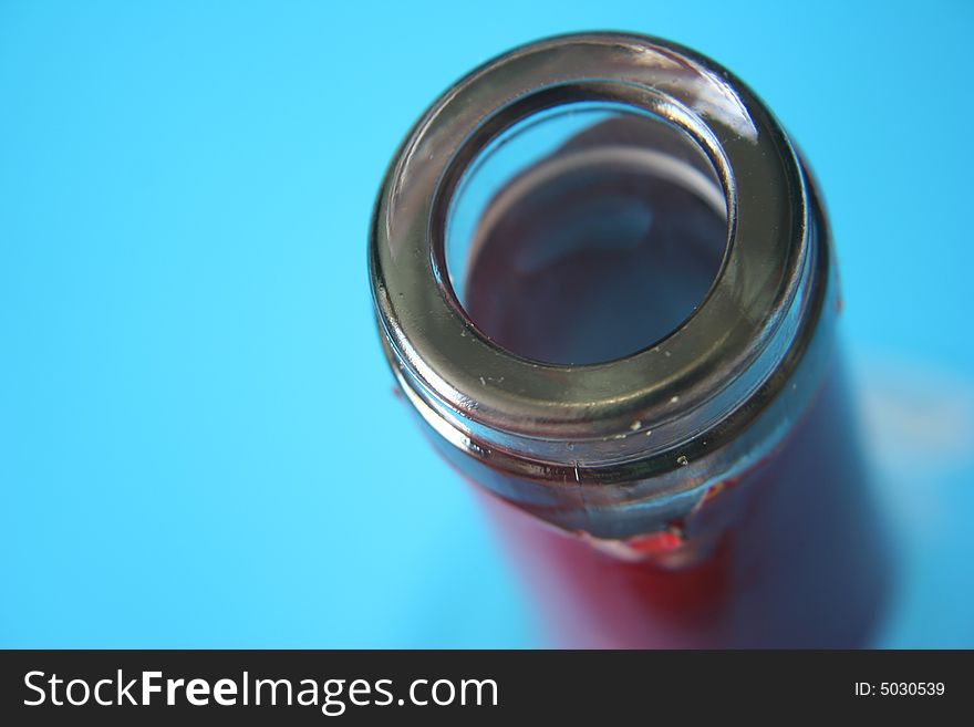 Bottle mouth on blue background. Bottle mouth on blue background