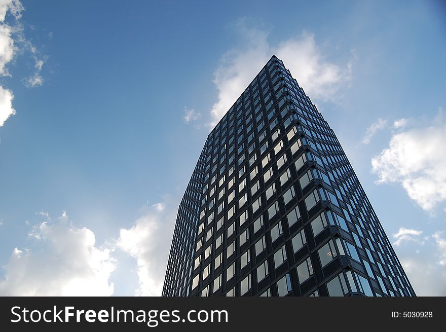 Bussiness building on cloudy sky background