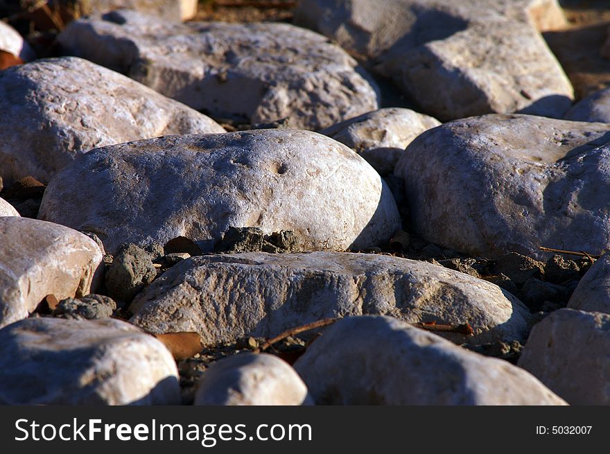 A close up of sidewalk made of rocks