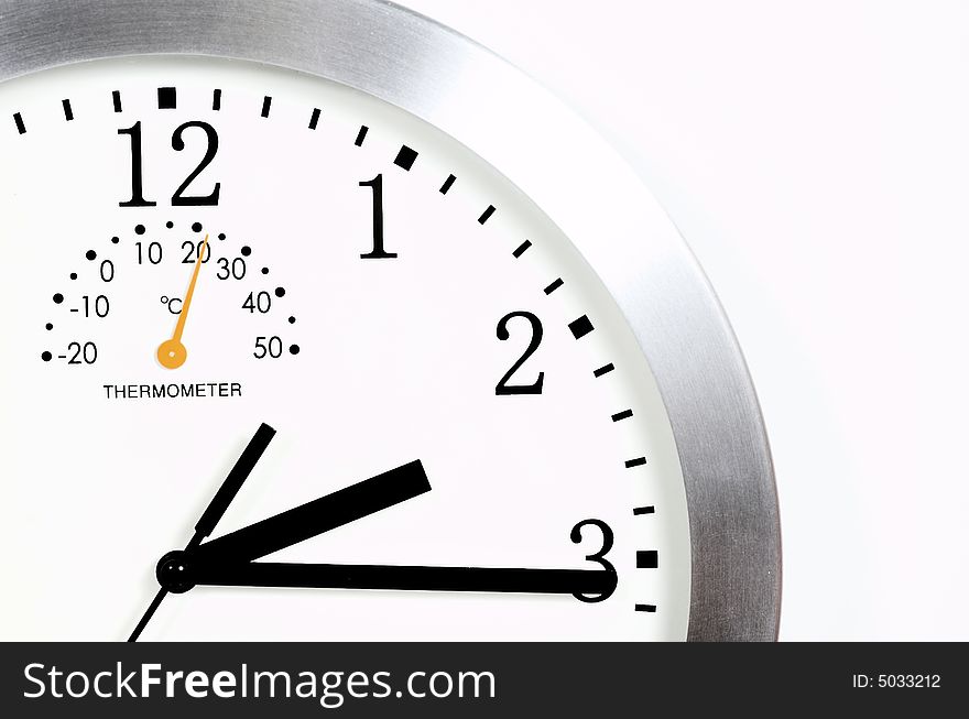 Close-up of a wall clock over white background