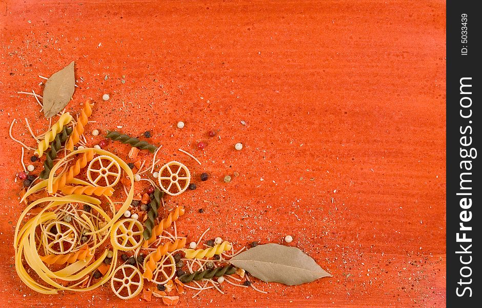 Still life with noodle and spices on hand painted orange backgroung. Still life with noodle and spices on hand painted orange backgroung