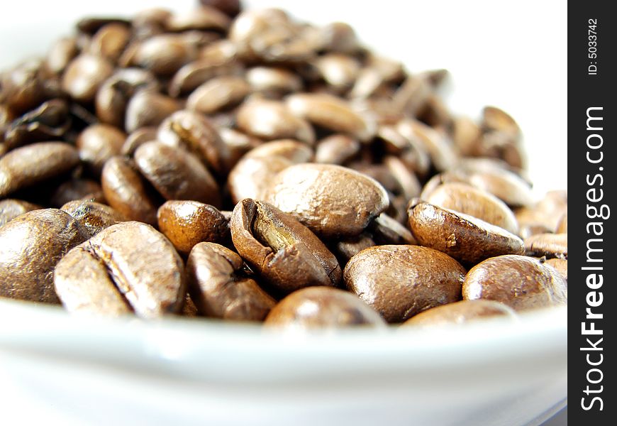 Natural black coffee beans closeup