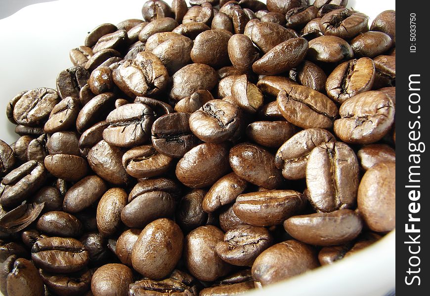 Natural black coffee beans closeup