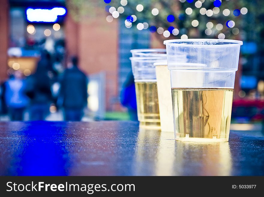 Plastic alcohol glasses in a party zone. Plastic alcohol glasses in a party zone.