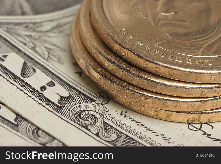 Abstract of the new U.S. Dollar coin on Dollar Bills with Narrow Depth of Field. Abstract of the new U.S. Dollar coin on Dollar Bills with Narrow Depth of Field.