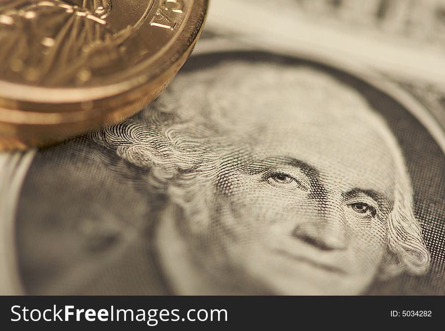 Extreme Close-up Abstract of the new U.S. Dollar coin on Dollar Bills with Narrow Depth of Field. Extreme Close-up Abstract of the new U.S. Dollar coin on Dollar Bills with Narrow Depth of Field.