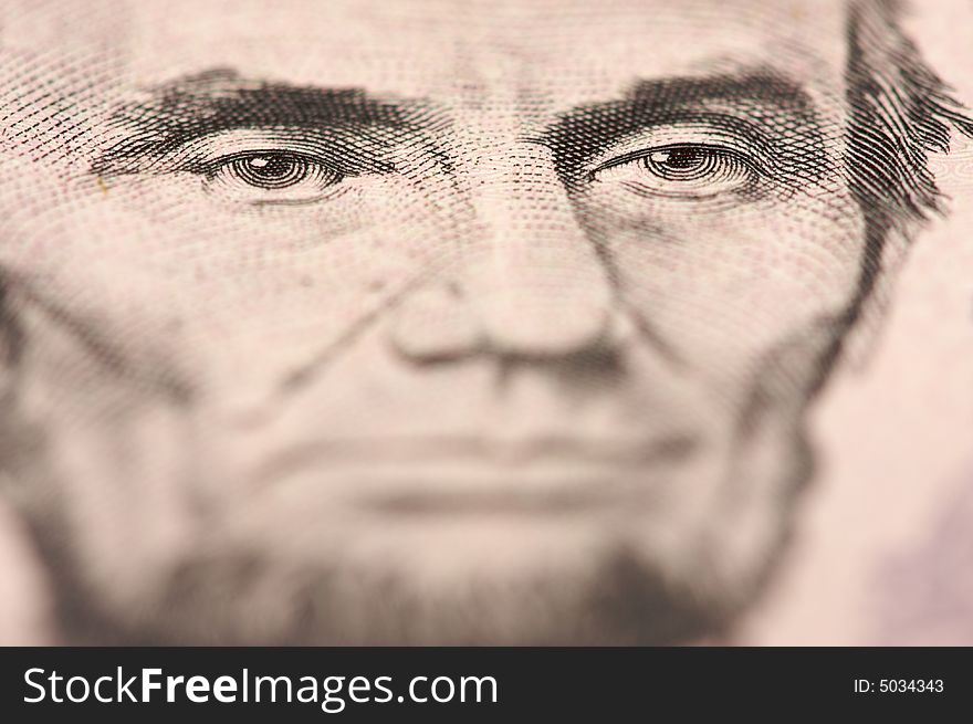 Abstract Macro of U.S. Five Dollar Bill's Abraham Lincoln face with Narrow Depth of Field. Abstract Macro of U.S. Five Dollar Bill's Abraham Lincoln face with Narrow Depth of Field.