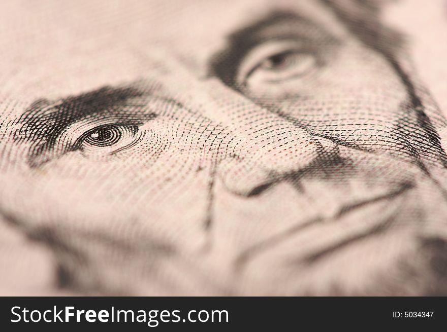 Abstract Macro of U.S. Five Dollar Bill's Abraham Lincoln face with Narrow Depth of Field. Abstract Macro of U.S. Five Dollar Bill's Abraham Lincoln face with Narrow Depth of Field.