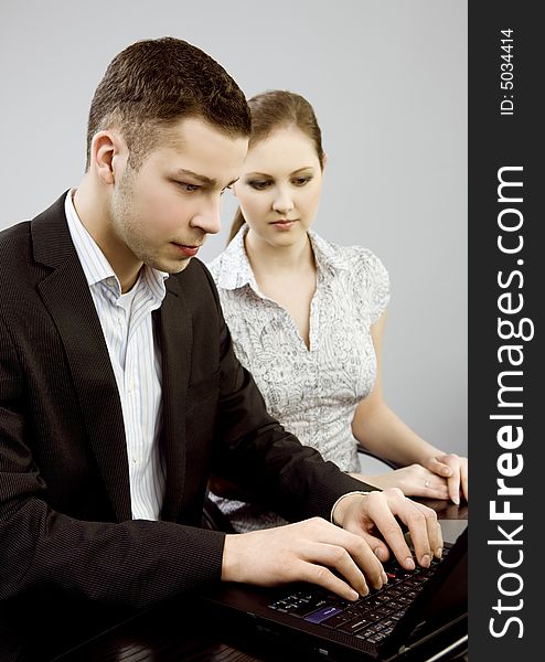 Business couple portrait - young man and woman working together. Business couple portrait - young man and woman working together