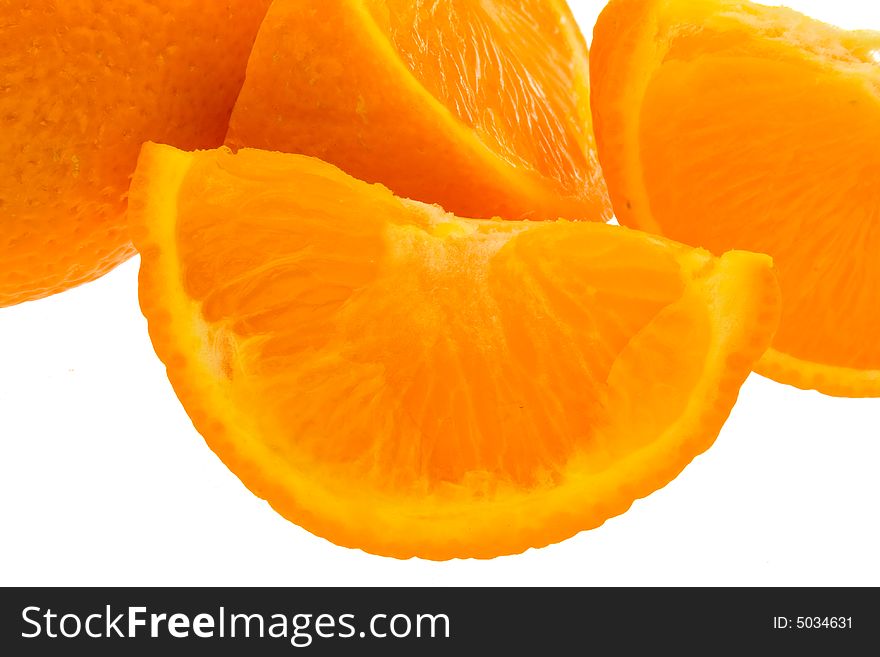 Whole orange plus segments against white background