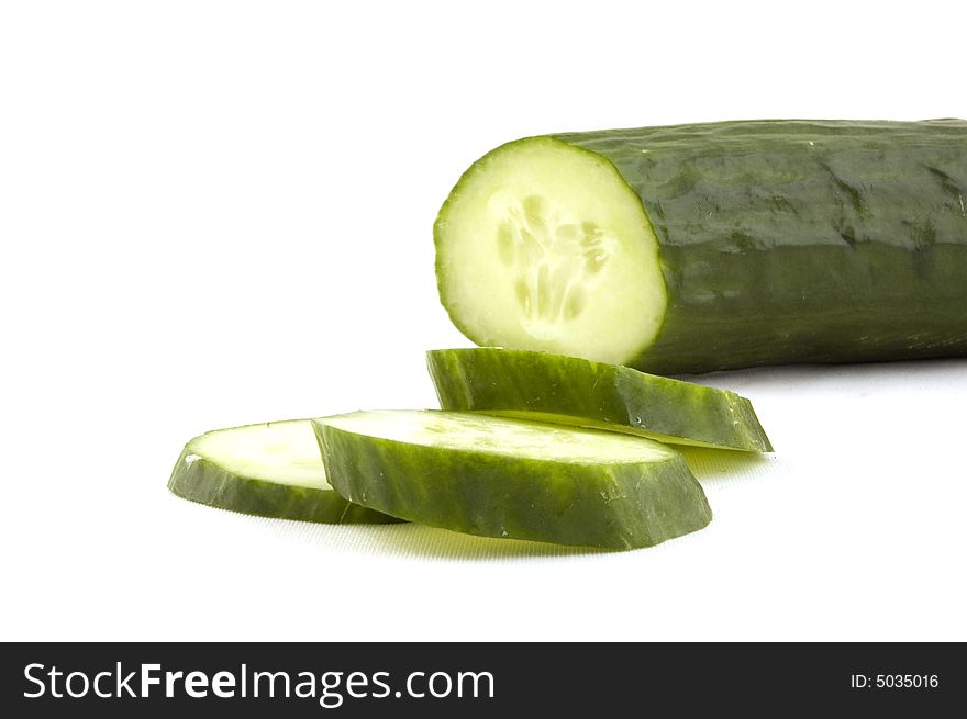 Cucumber with slices isolated on white