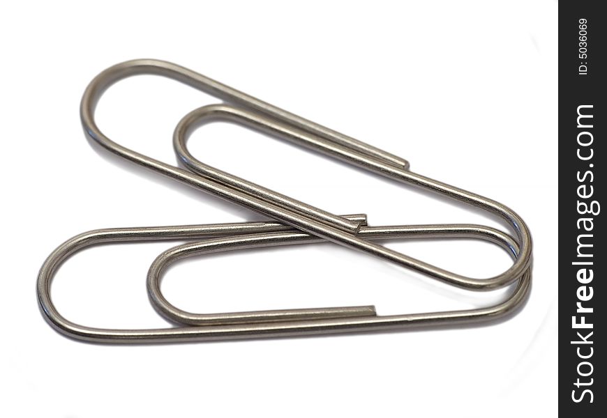 Close up paper clip isolated on white