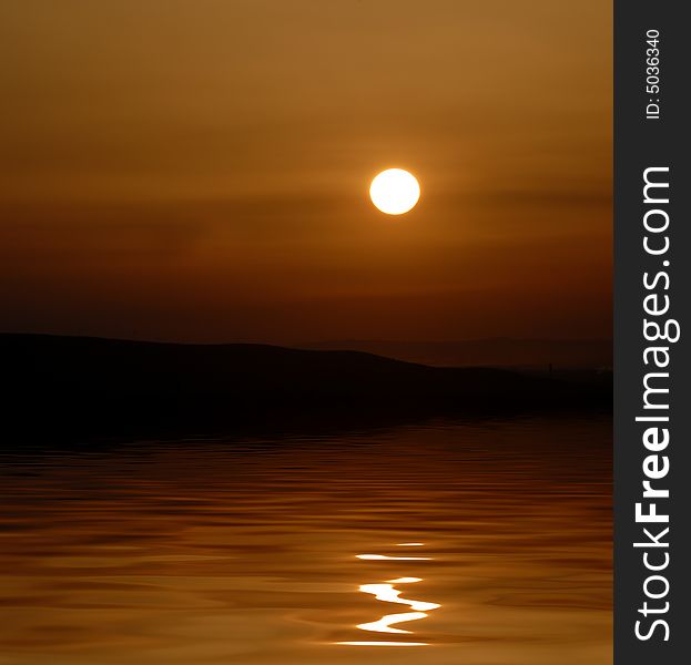 Sunset with sunstar and clouds in orange and golden light reflected in water. Sunset with sunstar and clouds in orange and golden light reflected in water