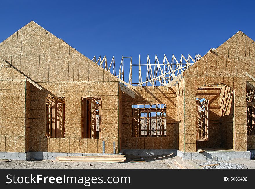 New home being built and detail of construction site. New home being built and detail of construction site