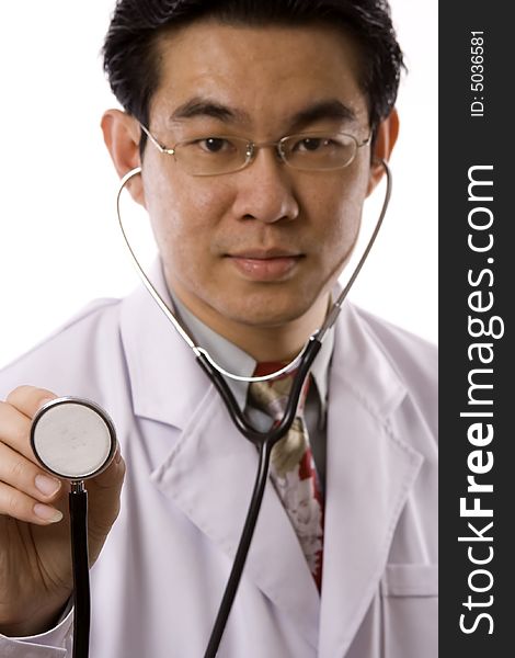 Female doctor holding a stethoscope in white background. Female doctor holding a stethoscope in white background.