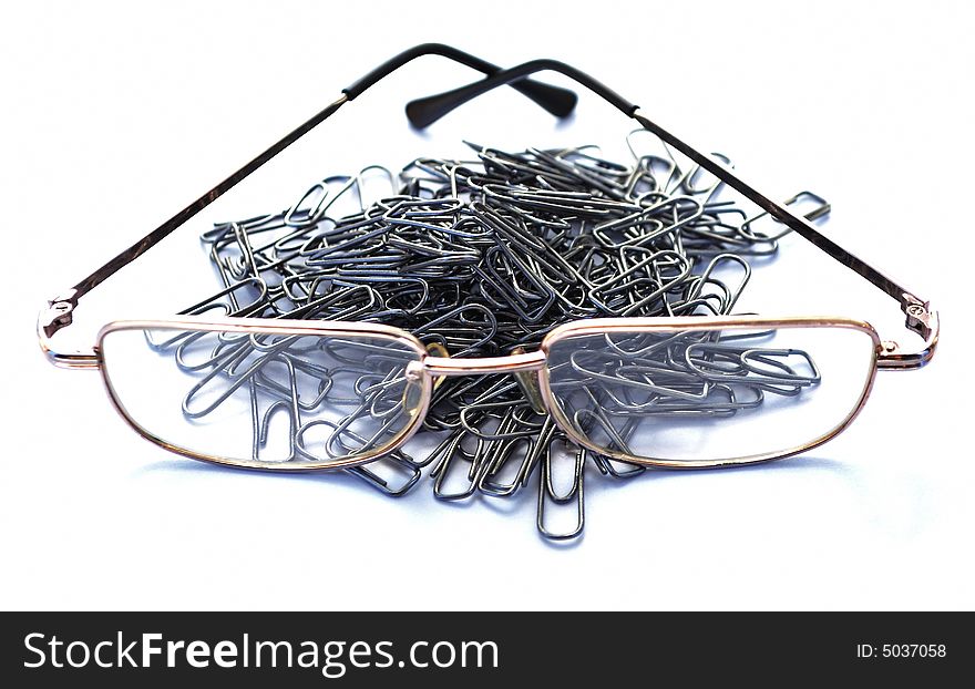 Clips and glasses on a piece of paper. Business scene