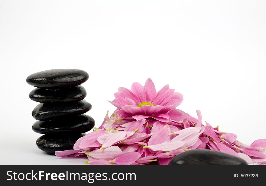 A stack of black stones for SPA and flower. A stack of black stones for SPA and flower