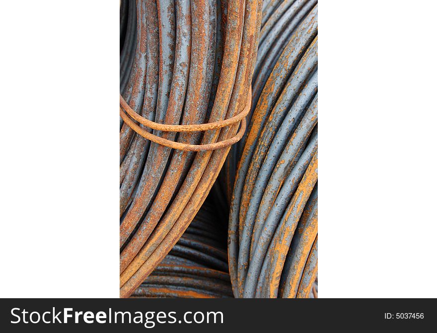Large rusty steel coils in a factory. Large rusty steel coils in a factory