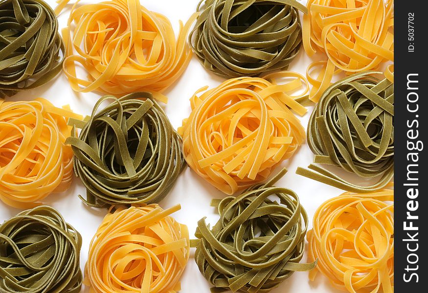 Colorful uncooked italian pasta tagliatelle. Colorful uncooked italian pasta tagliatelle