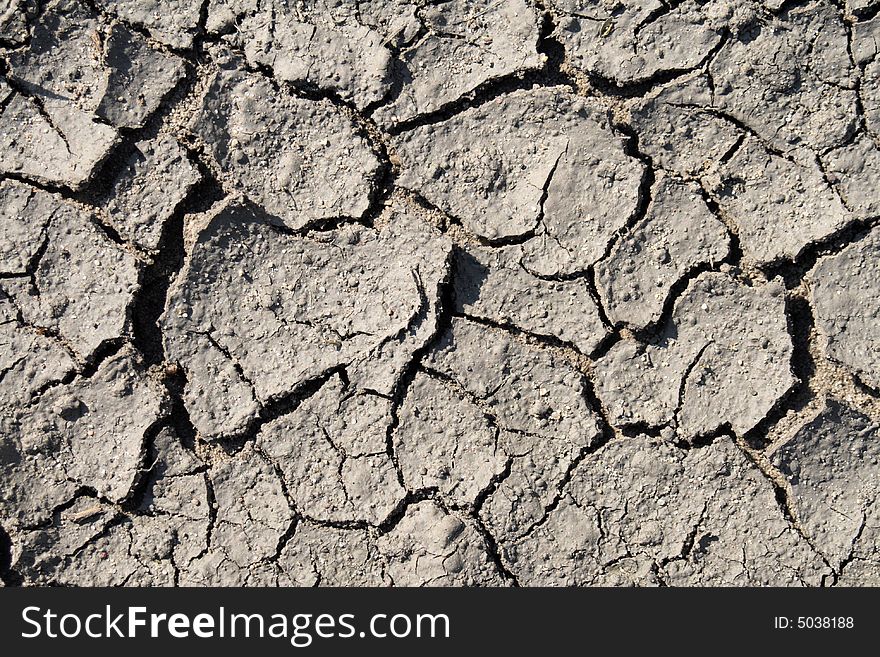 Close - up of cracked, dry mud. Close - up of cracked, dry mud.