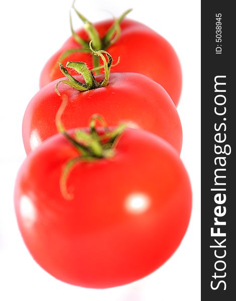 Fresh red tomatoes (central tomato in focus). Fresh red tomatoes (central tomato in focus)