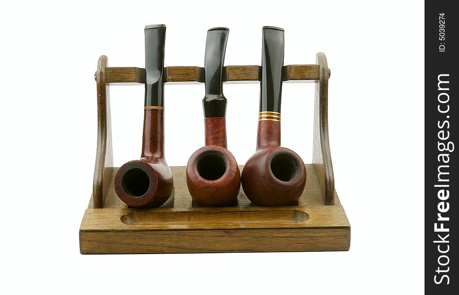 Tobacco-pipes with tobacco powder isolated over white background. Tobacco-pipes with tobacco powder isolated over white background