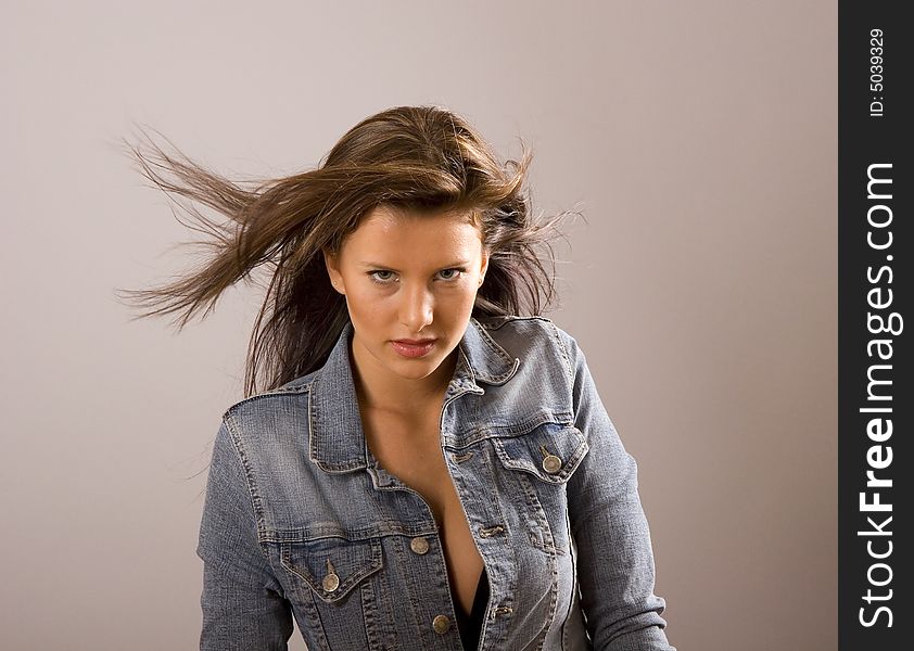 Brunette with Hair Blowing and Jacket Open