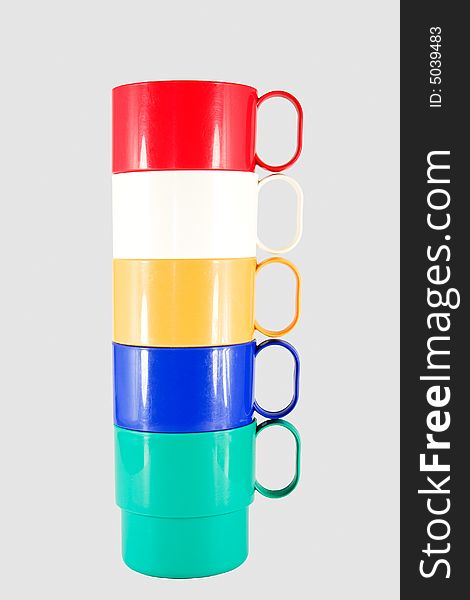 Stack of plastic mugs in various colors