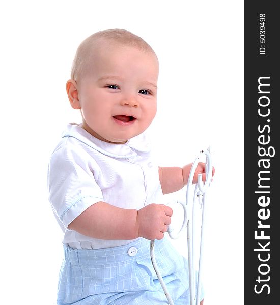 Closeup of smiling baby boy sitting in front of white background. Closeup of smiling baby boy sitting in front of white background