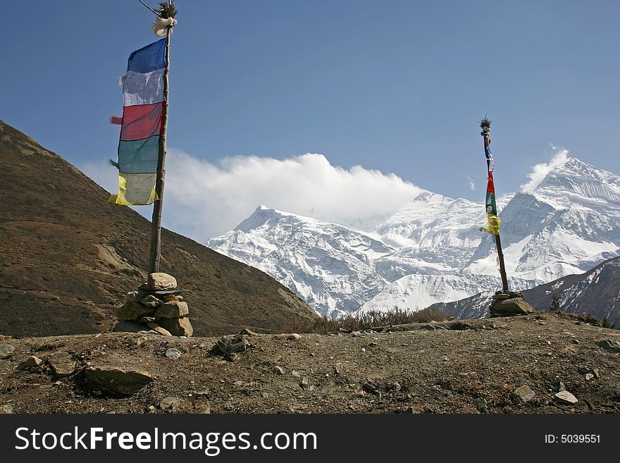Praying flags and poles in annapurna, nepal