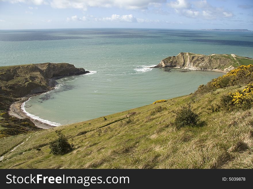 The beautiful bay on the Dorset coast in southern England. The beautiful bay on the Dorset coast in southern England