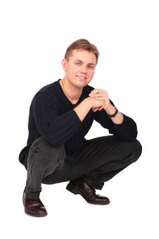 Young Man Sits On One S Hunkers Royalty Free Stock Image